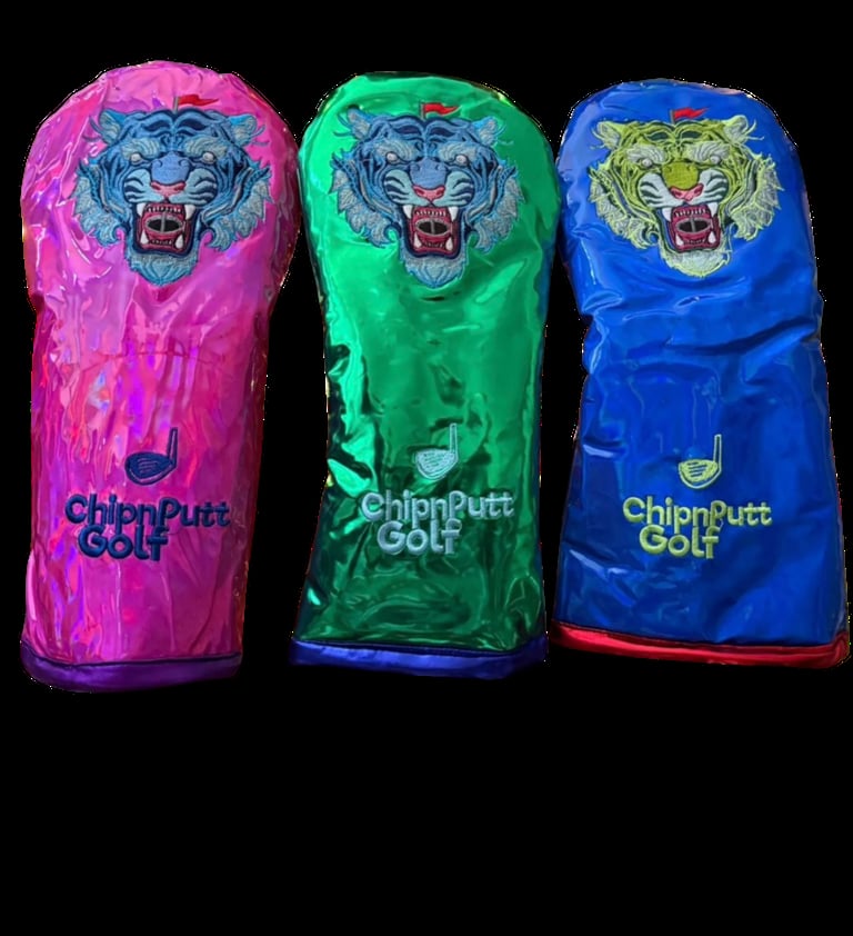 Three ChipnPutt Golf headcovers in pink, green, and blue with tiger graphics on black background